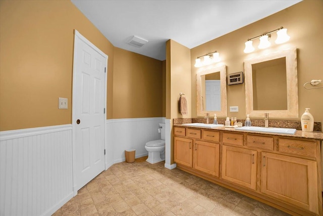 157 Concord Dr, Oswego, IL 60543 - bathroom with double vanity and wainscoting