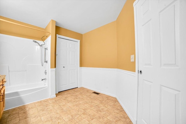 157 Concord Dr, Oswego, IL 60543 - unfurnished bedroom with wainscoting and light floors