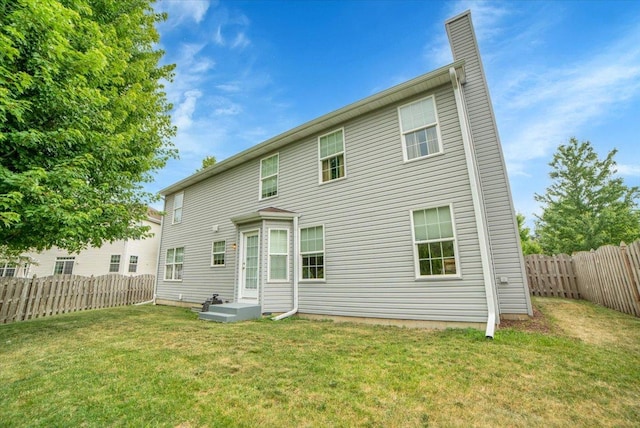 157 Concord Dr, Oswego, IL 60543 - rear view of property with a fenced backyard and a chimney