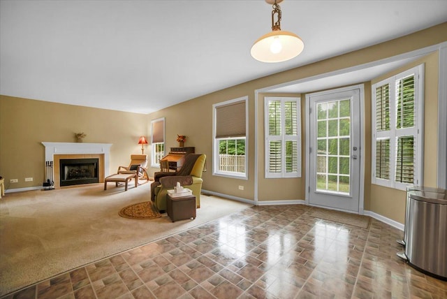 157 Concord Dr, Oswego, IL 60543 - living area featuring a fireplace with flush hearth and carpet floors