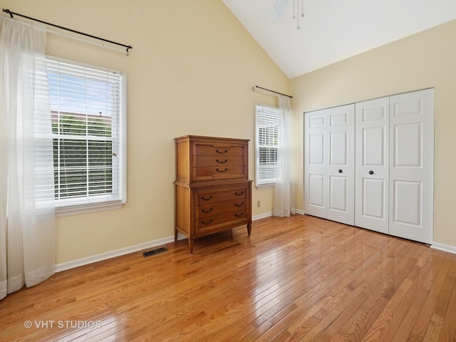 1135 Lexington Ln, Lake Zurich, IL 60047 - bedroom with light wood-style flooring, multiple windows, a closet, and high vaulted ceiling