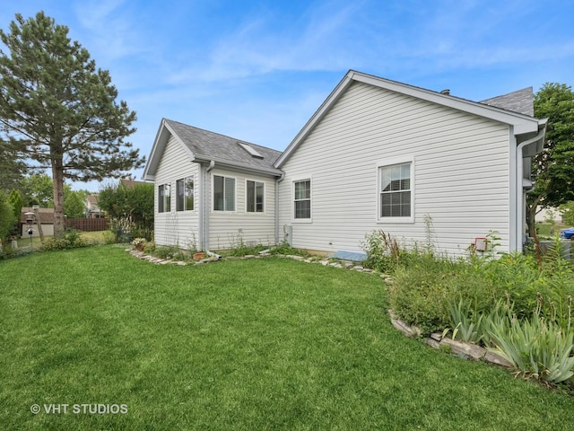 1135 Lexington Ln, Lake Zurich, IL 60047 - back of house with a yard and roof with shingles