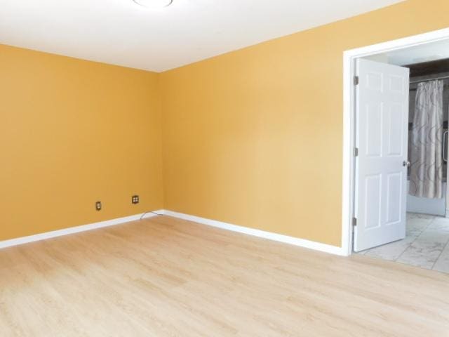 711 Glendale Ave, Rockford, IL 61108 - spare room with baseboards and light wood-style flooring