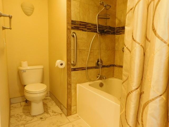 711 Glendale Ave, Rockford, IL 61108 - full bathroom with shower / bathtub combination with curtain and marble look tiles