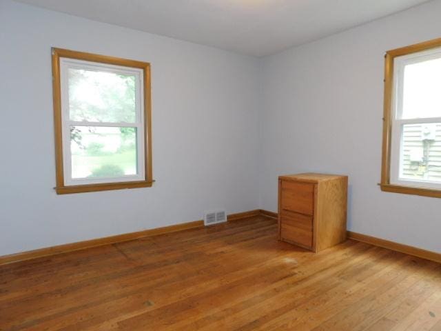 711 Glendale Ave, Rockford, IL 61108 - spare room with healthy amount of natural light and light wood-style flooring