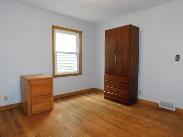 711 Glendale Ave, Rockford, IL 61108 - unfurnished bedroom featuring light wood finished floors and baseboards
