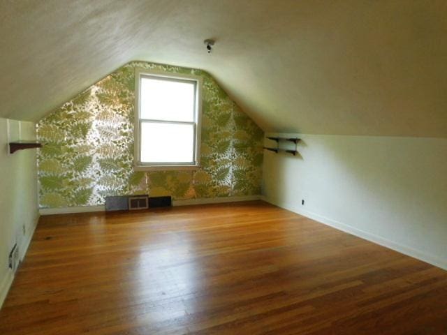 711 Glendale Ave, Rockford, IL 61108 - bonus room featuring wood finished floors and lofted ceiling