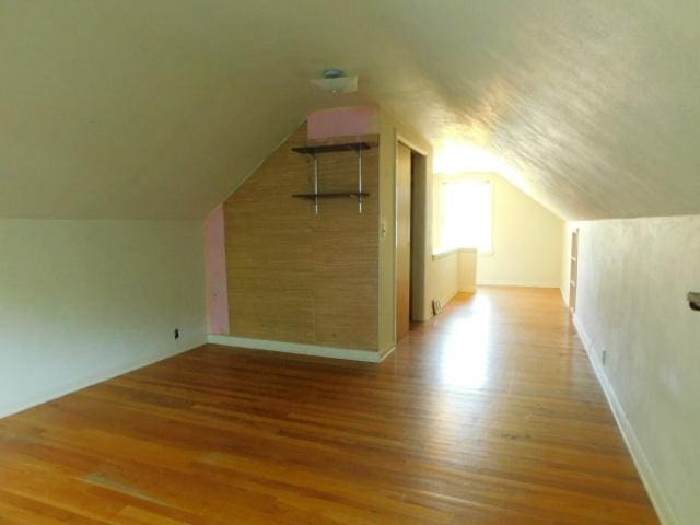 711 Glendale Ave, Rockford, IL 61108 - bonus room featuring wood finished floors and vaulted ceiling