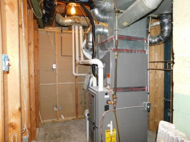 711 Glendale Ave, Rockford, IL 61108 - utility room with heating unit