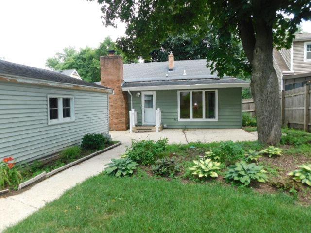 711 Glendale Ave, Rockford, IL 61108 - rear view of property with a patio area and a chimney