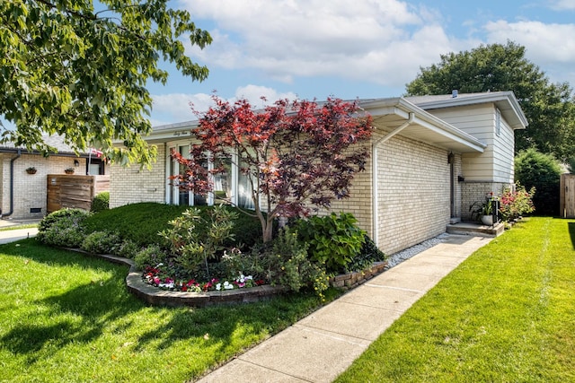 6955 N Dowagiac Ave, Chicago, IL 60646 - obstructed view of property featuring brick siding and a front yard