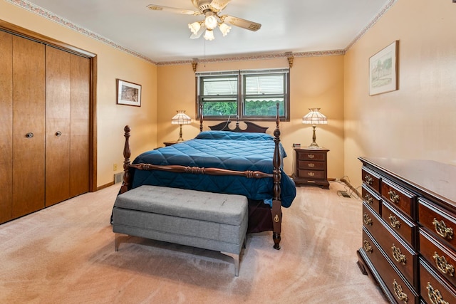 6955 N Dowagiac Ave, Chicago, IL 60646 - bedroom featuring light colored carpet, crown molding, a closet, and ceiling fan