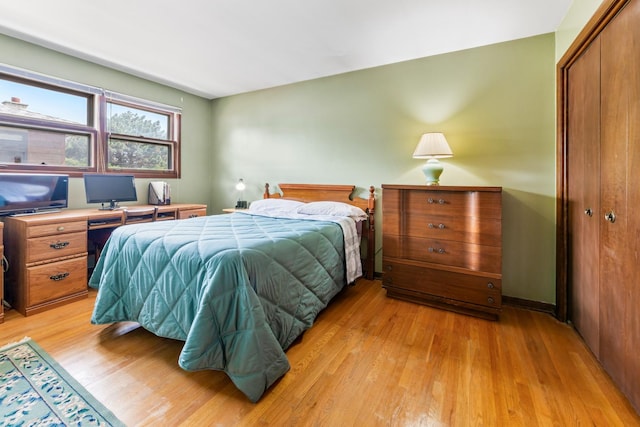 6955 N Dowagiac Ave, Chicago, IL 60646 - bedroom featuring light wood-type flooring and a closet