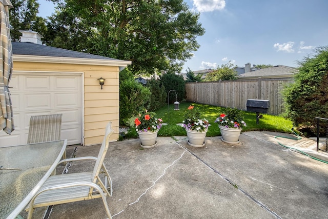 6955 N Dowagiac Ave, Chicago, IL 60646 - view of patio with an outbuilding, area for grilling, and a garage