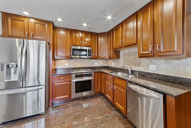 6955 N Dowagiac Ave, Chicago, IL 60646 - kitchen featuring appliances with stainless steel finishes, brown cabinets, dark stone counters, recessed lighting, and decorative backsplash