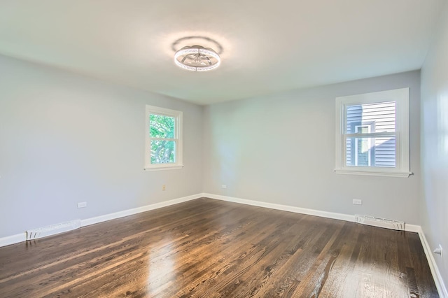 2630 Grunewald St, Blue Island, IL 60406 - unfurnished room with baseboards and dark wood finished floors