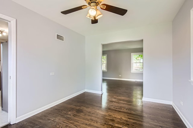 2630 Grunewald St, Blue Island, IL 60406 - empty room with dark wood finished floors and a ceiling fan