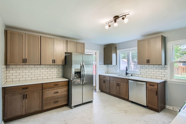 2630 Grunewald St, Blue Island, IL 60406 - kitchen with appliances with stainless steel finishes, plenty of natural light, tasteful backsplash, and light countertops