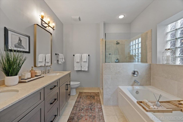 2340 W Roscoe St Unit 2W, Chicago, IL 60618 - bathroom featuring double vanity, a garden tub, walk in shower, and tile patterned floors