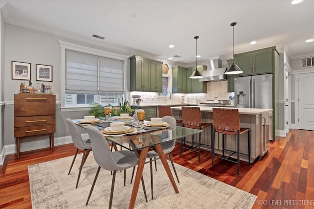 2340 W Roscoe St Unit 2W, Chicago, IL 60618 - dining space with crown molding, wood finished floors, and recessed lighting