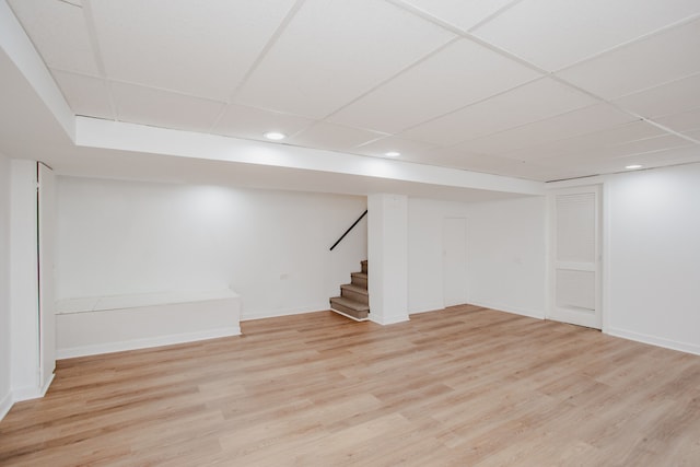 8909 N Washington St Unit E, Niles, IL 60714 - finished basement with a paneled ceiling, recessed lighting, stairs, and light wood-style floors