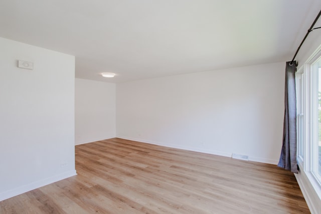 8909 N Washington St Unit E, Niles, IL 60714 - empty room with light wood-type flooring