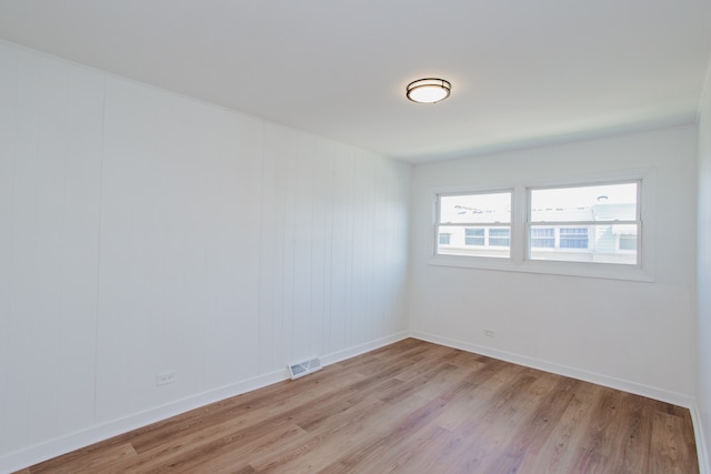 8909 N Washington St Unit E, Niles, IL 60714 - empty room featuring light wood finished floors
