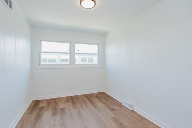 8909 N Washington St Unit E, Niles, IL 60714 - unfurnished room with light wood finished floors and baseboards