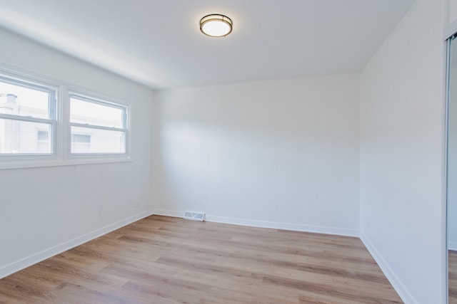 8909 N Washington St Unit E, Niles, IL 60714 - empty room featuring light wood finished floors and baseboards