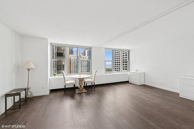 400 E Randolph St Unit 2902, Chicago, IL 60601 - spare room with dark wood-style flooring and baseboards
