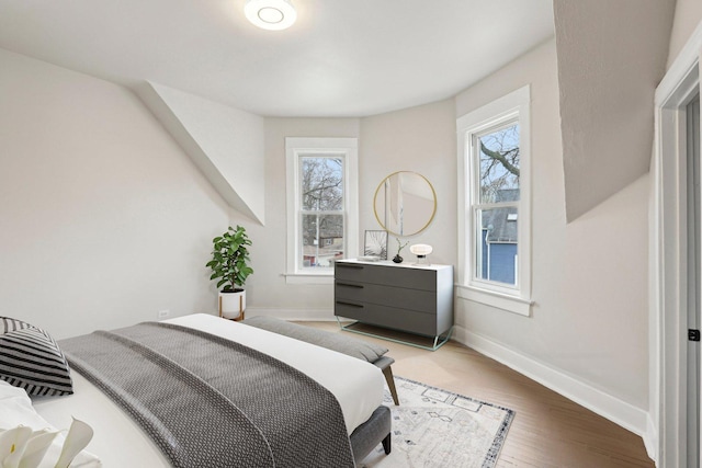7959 S Saginaw Ave, Chicago, IL 60617 - bedroom with multiple windows and light wood-type flooring
