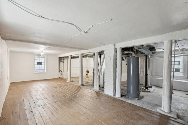 7959 S Saginaw Ave, Chicago, IL 60617 - below grade area featuring water heater and wood-type flooring
