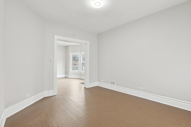 7959 S Saginaw Ave, Chicago, IL 60617 - unfurnished room with wood-type flooring and baseboards