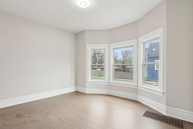 7959 S Saginaw Ave, Chicago, IL 60617 - unfurnished room featuring baseboards and wood finished floors