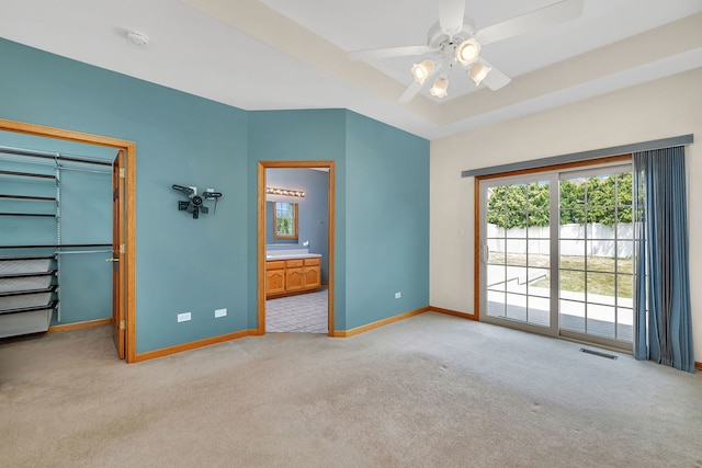 1824 Mia Dr, Crest Hill, IL 60403 - unfurnished bedroom featuring light carpet, access to exterior, connected bathroom, ceiling fan, and a walk in closet