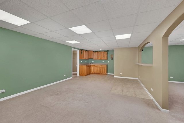 1824 Mia Dr, Crest Hill, IL 60403 - unfurnished living room with light colored carpet, a paneled ceiling, and arched walkways