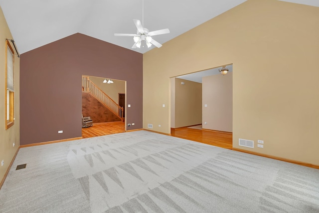 1824 Mia Dr, Crest Hill, IL 60403 - carpeted empty room with stairs, ceiling fan, and high vaulted ceiling
