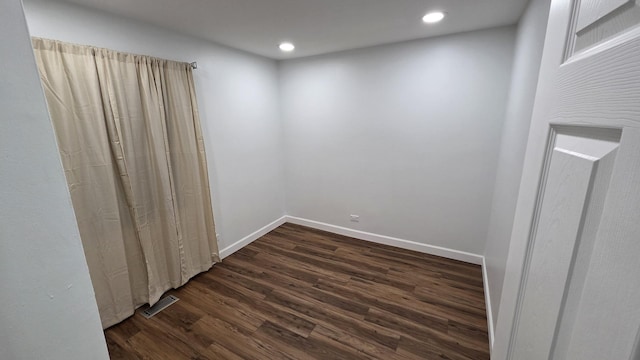 1303 Kingsbury Dr Unit A, Hanover Park, IL 60133 - unfurnished room featuring dark wood-type flooring and recessed lighting