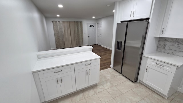 1303 Kingsbury Dr Unit A, Hanover Park, IL 60133 - kitchen featuring stainless steel fridge, light countertops, white cabinetry, recessed lighting, and backsplash