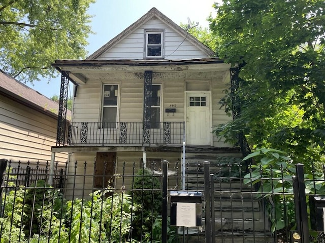 8447 S Escanaba Ave, Chicago, IL 60617 - view of front of house featuring a fenced front yard and covered porch
