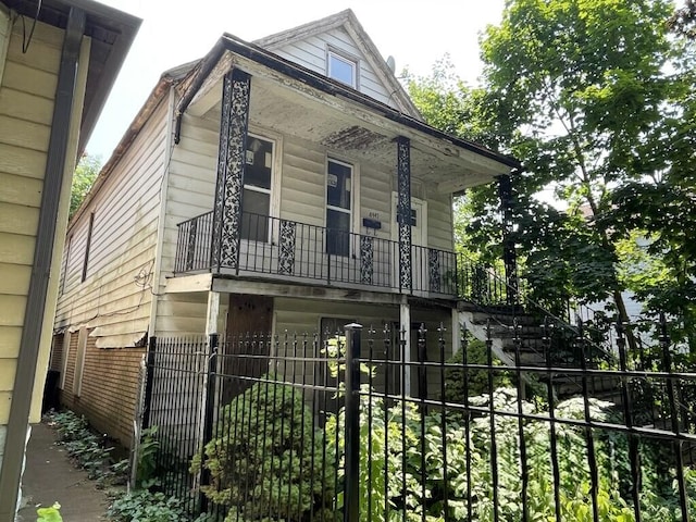 8447 S Escanaba Ave, Chicago, IL 60617 - view of front facade with a fenced front yard and covered porch