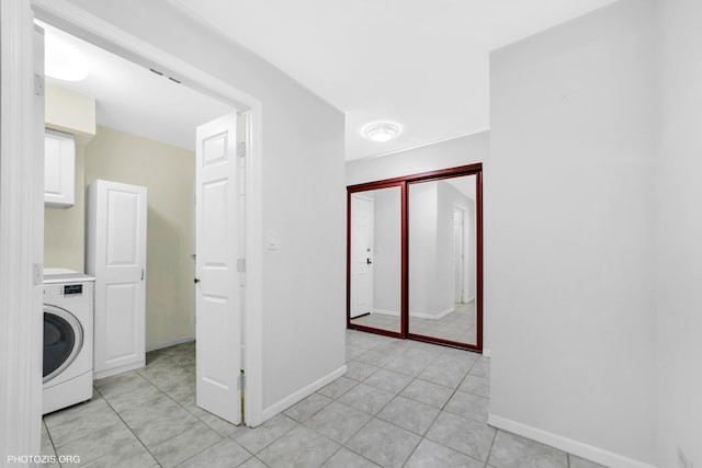 1621 Mission Hills Rd Unit 510, Northbrook, IL 60062 - laundry area with washer / clothes dryer, cabinet space, and light tile patterned floors