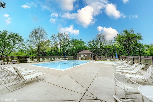 1621 Mission Hills Rd Unit 510, Northbrook, IL 60062 - community pool featuring a patio and view of scattered trees
