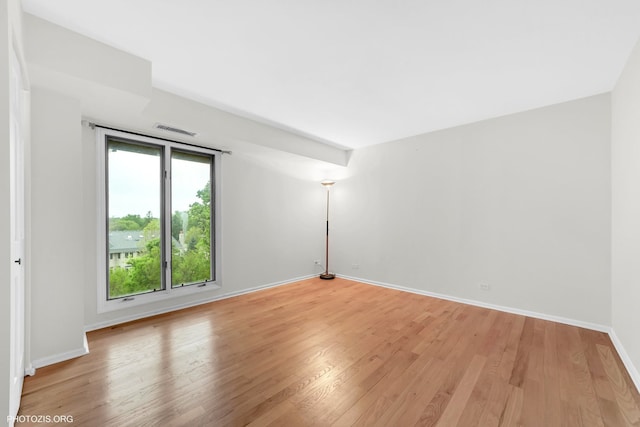 1621 Mission Hills Rd Unit 510, Northbrook, IL 60062 - spare room featuring light wood-type flooring and baseboards