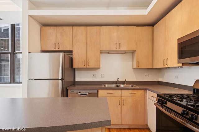 212 W Washington St Unit 1112, Chicago, IL 60606 - kitchen featuring appliances with stainless steel finishes, dark countertops, and light brown cabinets