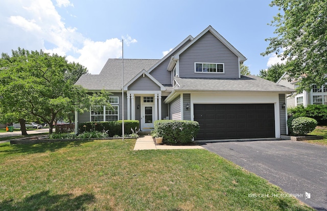 361 Lexington Ln, Grayslake, IL 60030 - view of front of property with driveway, a front lawn, roof with shingles, and an attached garage