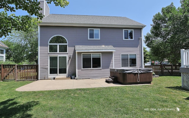 361 Lexington Ln, Grayslake, IL 60030 - back of property featuring a hot tub, a patio, a fenced backyard, and roof with shingles