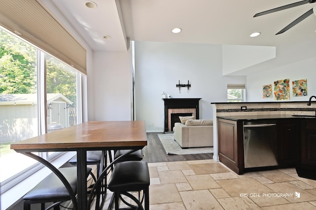 361 Lexington Ln, Grayslake, IL 60030 - dining space with a ceiling fan, a fireplace, recessed lighting, and stone tile floors