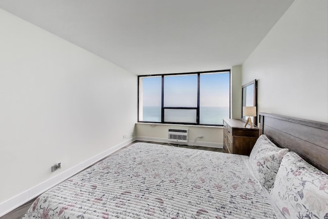 940 W Glenlake Ave Unit 19C, Chicago, IL 60660 - bedroom with baseboards and an AC wall unit