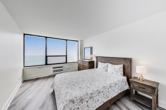 940 W Glenlake Ave Unit 19C, Chicago, IL 60660 - bedroom with wood finished floors and an AC wall unit